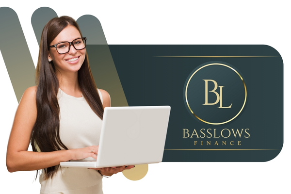 Professional financial consultant using laptop beside Basslows Finance branding panel